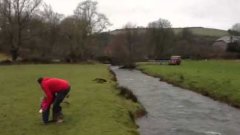 Ninja dog jumps over a river