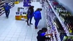 Alcohol shelf collapses in front of two girls shopping for drink