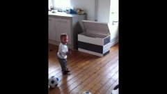 Baby Kicks Soccer Balls In Toy Chest