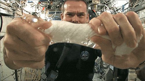 Wringing out a washcloth in space