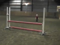 10 years girl jumps hurdles on four legs