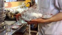 Waiter Serves 14 Cups Of Hot Tea At Once