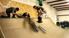 Skateboarder Backflips From One Board To Another