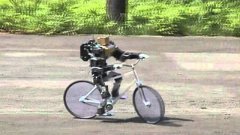 Mini Robot Rides Bicycle