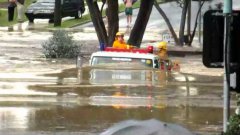 Fire Truck Drives Through Australian Flooded Road