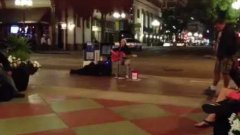 Beautiful musician on sidewalk in downtown San Diego