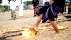 Flaming football: indonesian students play football with fiery coconut