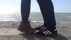 Couple kissing at the beach illusion