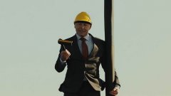Volvo president stands on truck hanging from giant crane commercial