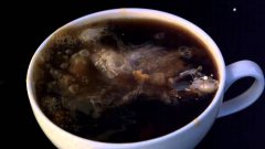 Creamer Poured Into Coffee In Super Slow Motion