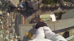 Daredevil Performs Handstand On Edge Of Building