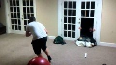 Kid Breaks Through Door Pushed By Exercise Ball